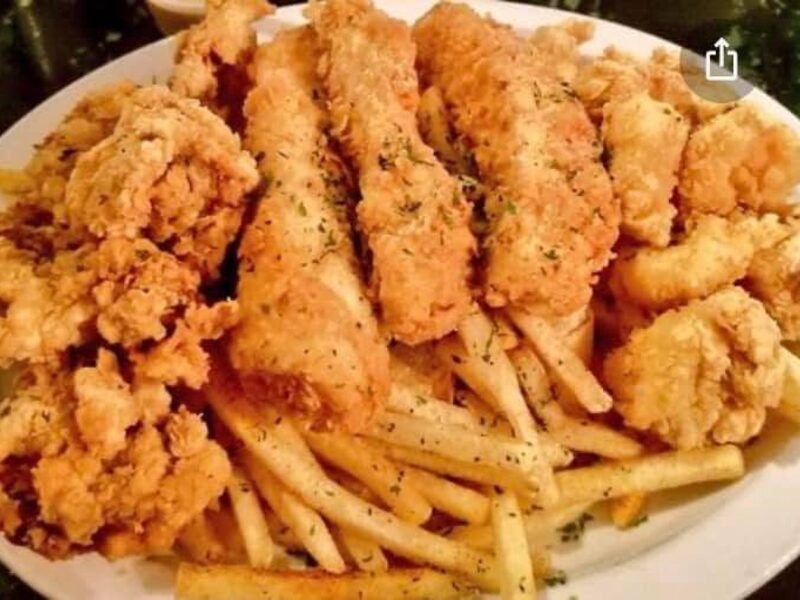 Fried catfish and seasoned fries platter at Nana's Taste & See